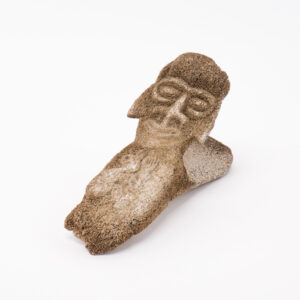 A carved bone oar rest with face carving and spirit figure. From Ancient Easter Islands